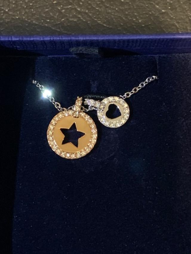 A necklace with star and heart shaped pendants